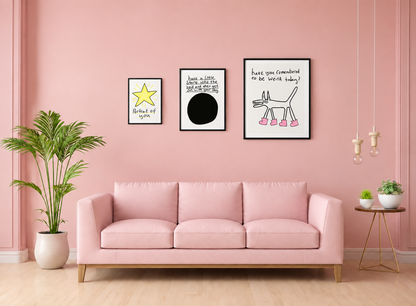 Pink living room with a sofa, decorative plants, and framed pictures on a pink wall.